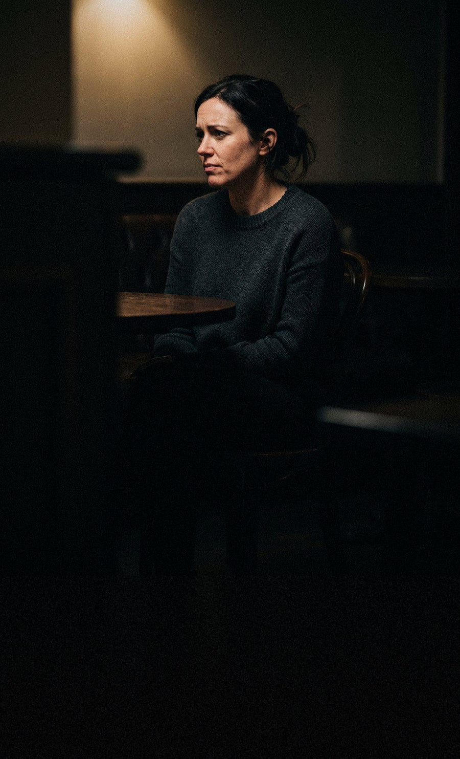 A man and a woman mid-conversation, reading each other's faces